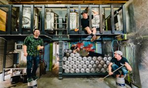 A group of people in a store Description automatically generated